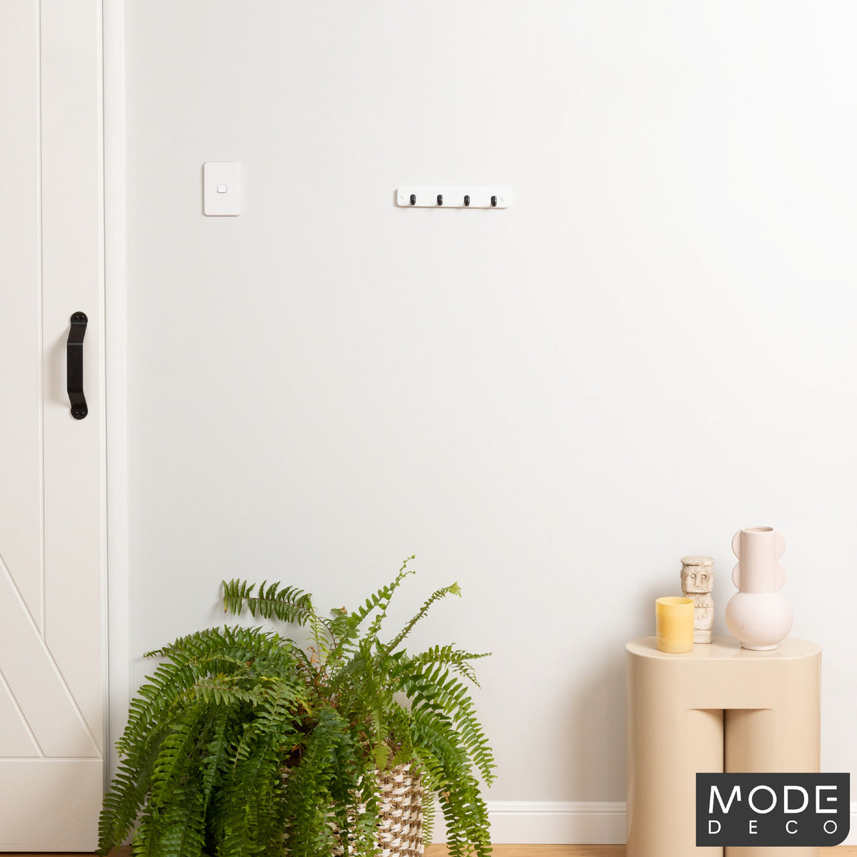 4 Black Hooks on White Board Key Rack
